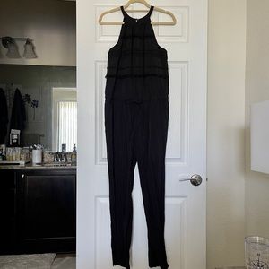 All black jumpsuit with pockets.
